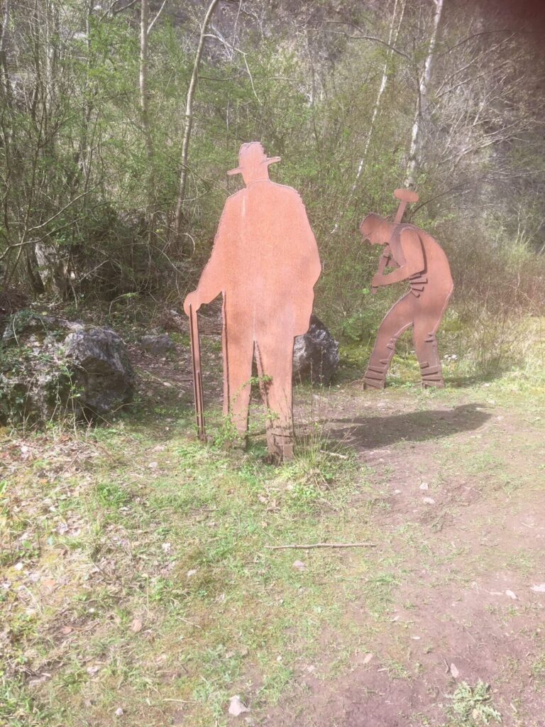 Life sized figures cut out of steel sheet to represent quarry workers.